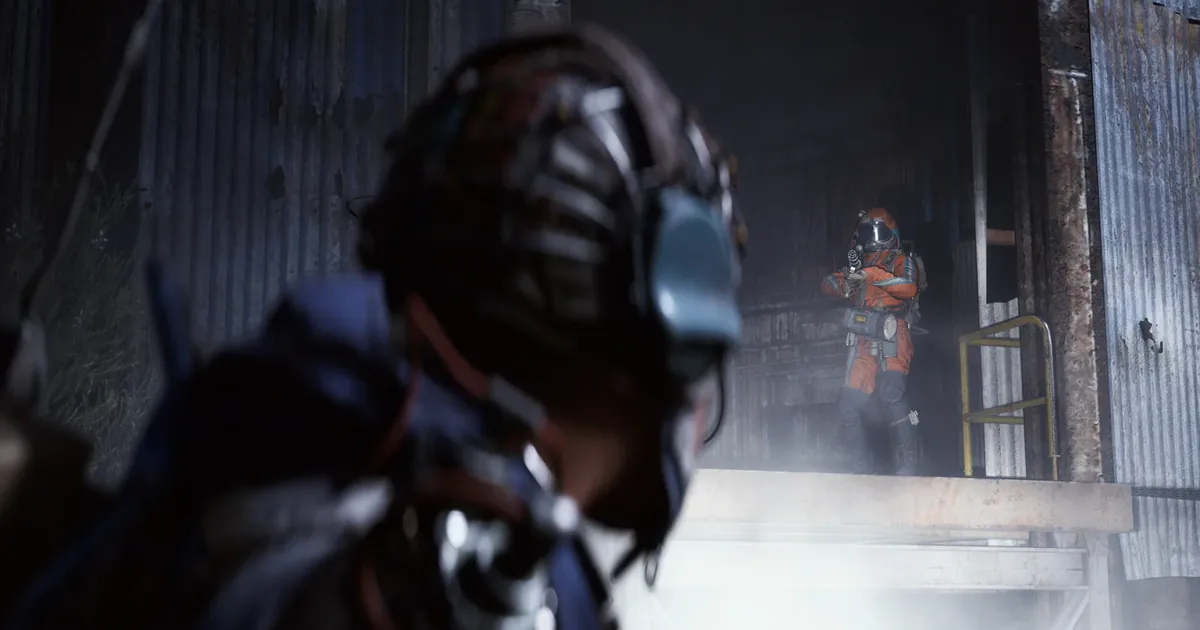 ARC Raiders raider moving through a narrow mountain pass corridor in Blue Gate with ARC machines patrolling stone ruins below