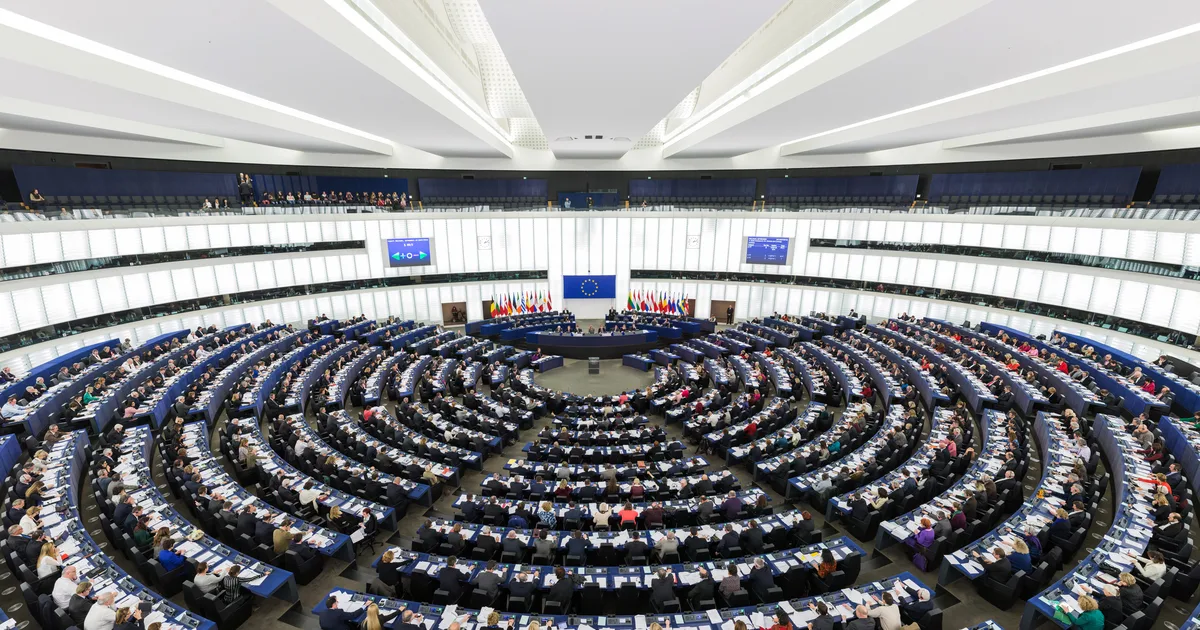 European Parliament chamber in session: wide shot of the hemicycle with MEPs at their seats